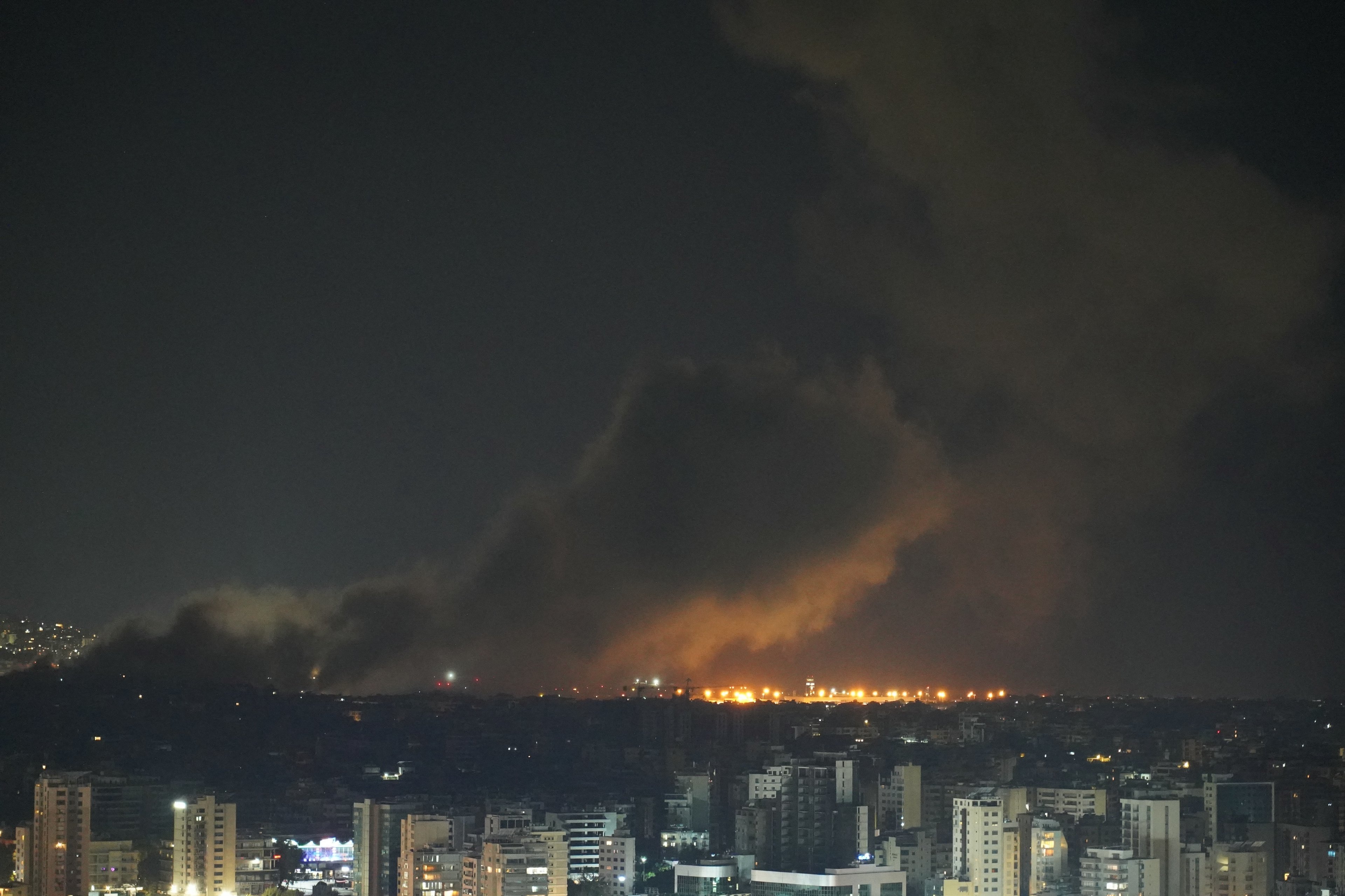 Smoke rises from the site of an Israeli airstrike that targeted a neighborhood in Beiruts southern suburb early on October 1, 2024. A Lebanese security official said Israel had conducted at least six strikes on south Beirut in the night from Monday to Tuesday, after Israel's army called on residents in the Hezbollah stronghold to evacuate. (Photo by ETIENNE TORBEY / AFP)