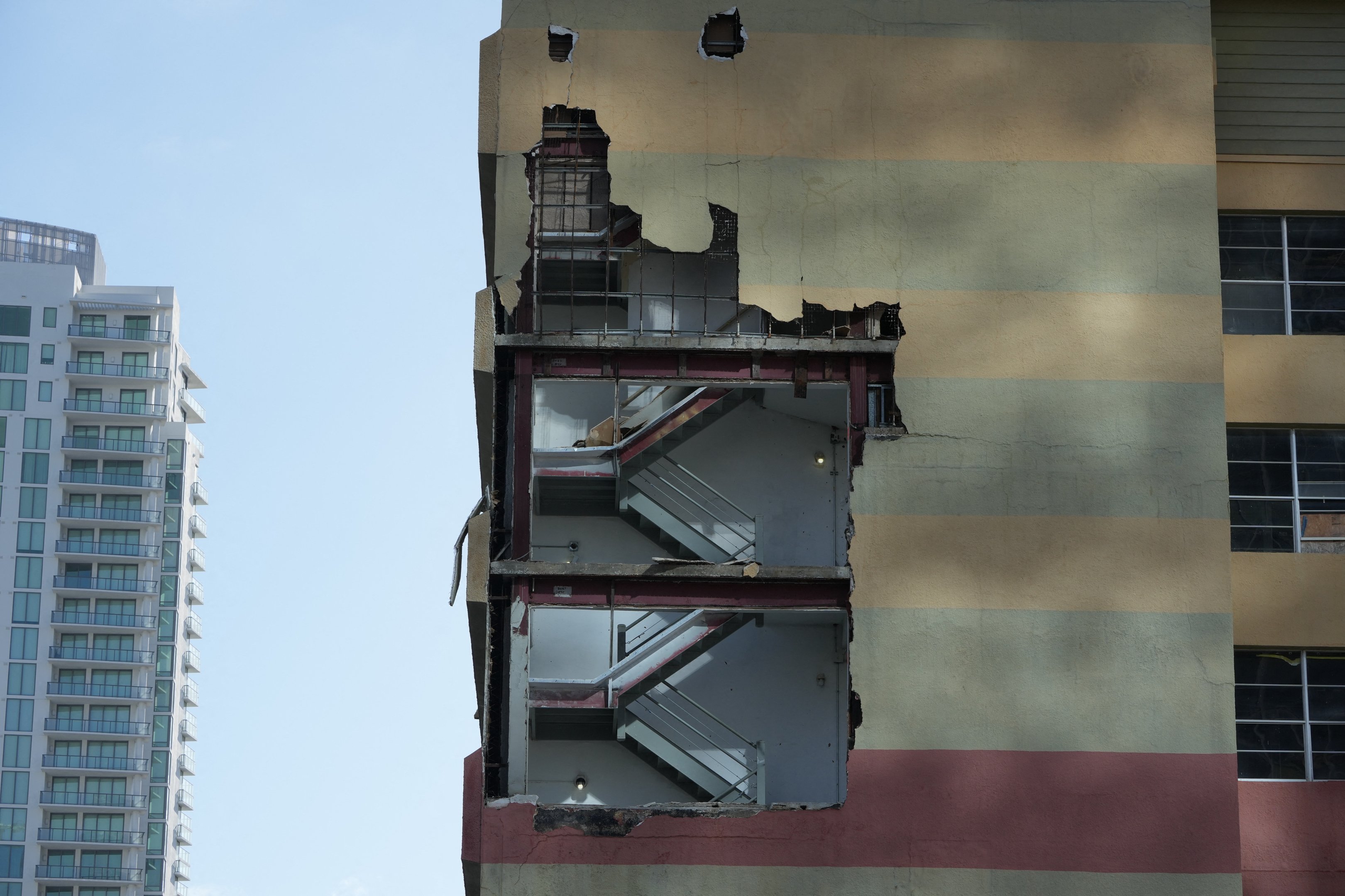 A stairwell wall is blown out in St. Petersburg due to Hurricane Milton on October 10, 2024 in Florida. At least four people were confirmed killed as a result of two tornadoes triggered by Hurricane Milton on the east coast of the US state of Florida, local authorities said Thursday. (Photo by Bryan R. SMITH / AFP)