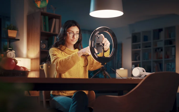 Young vlogger and content creator shooting a video for her followers, social media and communication concept (demaerre/Getty Images)