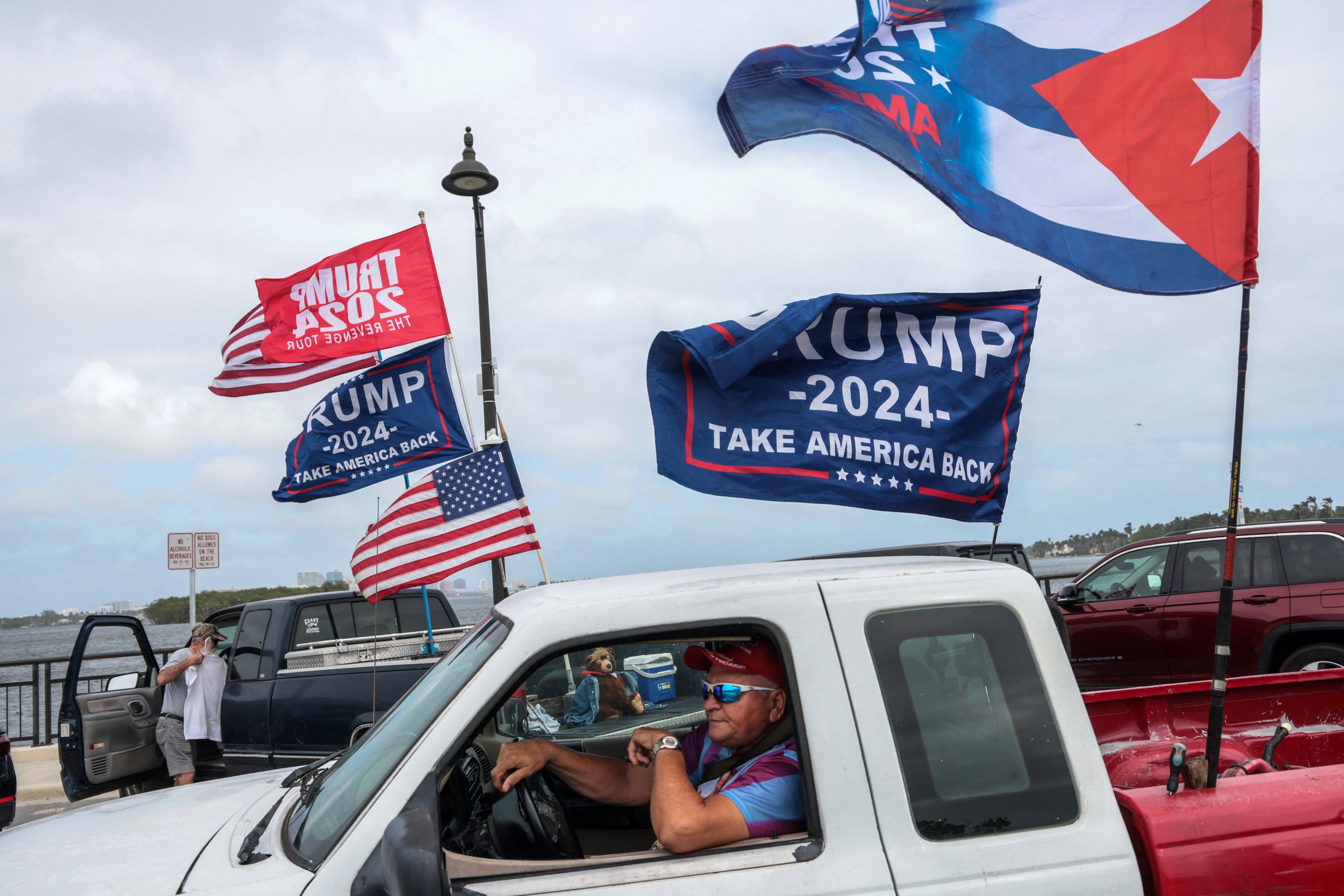 Supporters of former US President and Republican presidential candidate Donald Trump gather near his Mar-a-Lago resort in Palm Beach, Florida, on Election Day, November 5, 2024. (Photo by Giorgio Viera / AFP)