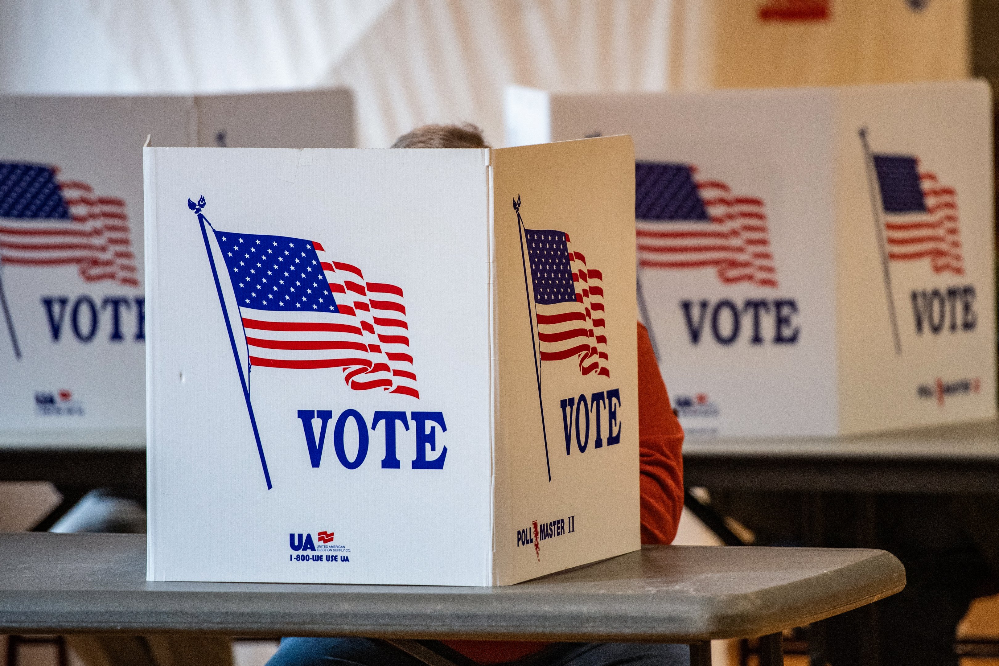 People vote at a polling station in Lancaster, New Hampshire, on Election Day, November 5, 2024. (Photo by Joseph Prezioso / AFP)