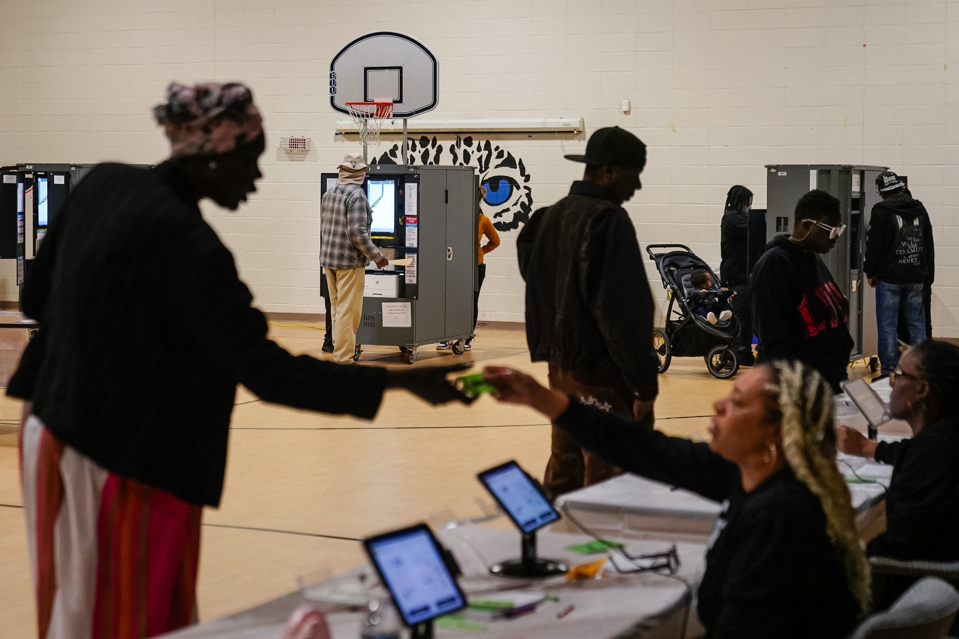 People vote at a polling station in Atlanta, Georgia, on Election Day, November 5, 2024. (Photo by Elijah Nouvelage / AFP)