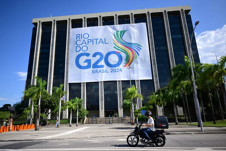 A G20 Summit banner is displayed at the City Hall in Rio de Janeiro, Brazil, on November 12, 2024. rThe G20 Leaders' Summit will take place in Rio de Janeiro between November 18 and 19, 2024. (Photo by Mauro PIMENTEL / AFP)