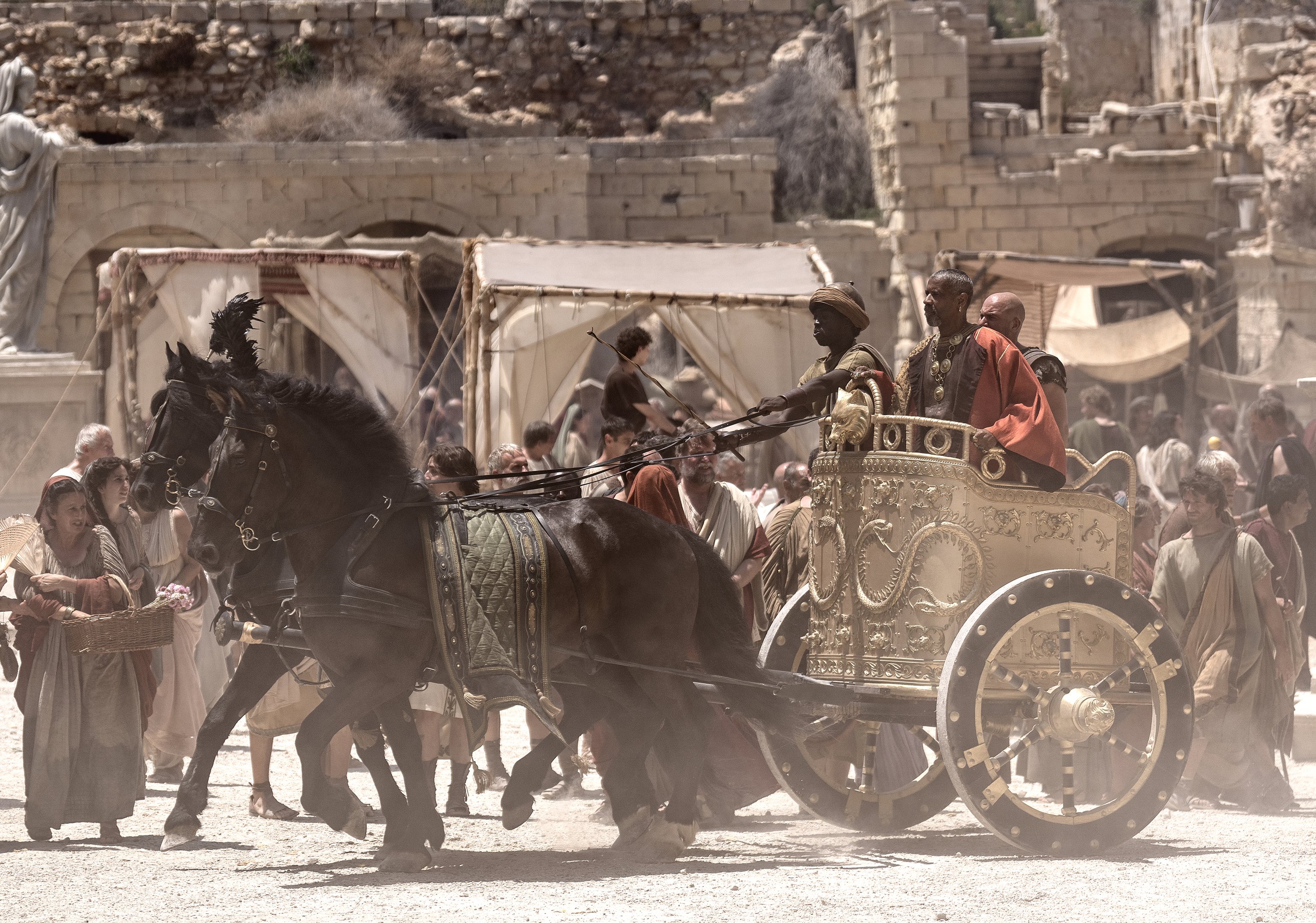 Denzel Washington plays Macrinus and Lior Raz plays Viggo in Gladiator II from Paramount Pictures.