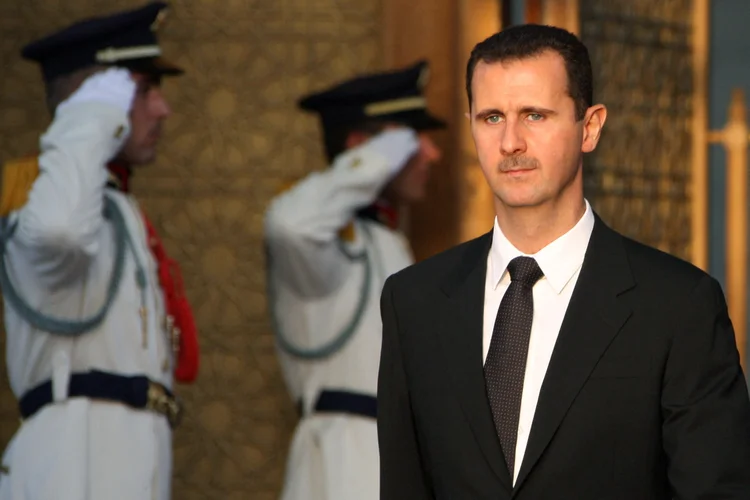 (FILES) Syrian President Bashar al-Assad waits for the arrival of his French counterpart in Damascus on September 3, 2008. Islamist-led rebels declared that they have taken Damascus in a lightning offensive on December 8, 2024, sending Assad fleeing and ending five decades of Baath rule in Syria. (Photo by Louai BESHARA / AFP) (Louai BESHARA/AFP)