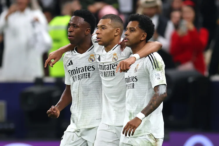 DOHA, QATAR - DECEMBER 18: Kylian Mbappe of Real Madrid celebrates with teammates Vinicius Junior and Rodrygo after scoring his team's first goal during the FIFA Intercontinental Cup between Real Madrid and CF Pachuca at Lusail Stadium on December 18, 2024 in Doha, Qatar.  (Photo by Christopher Pike - FIFA/FIFA via Getty Images) (Christopher Pike - FIFA//Getty Images)