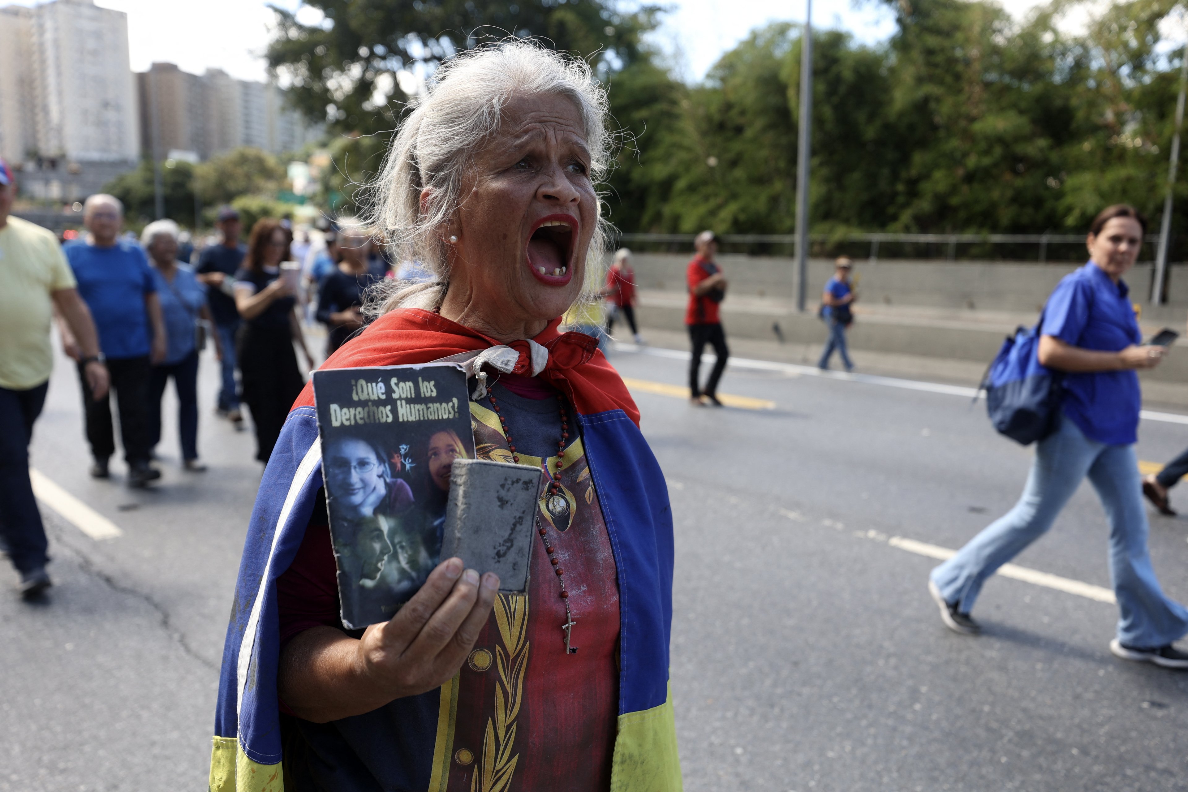 during a protest called by the opposition on the eve of the presidential inauguration, in Caracas on January 9, 2025. Venezuela is on tenterhooks facing demonstrations called by both the opposition and government supporters a day before President Nicolas Maduro is due to be sworn in for a third consecutive term and despite multiple countries recognizing opposition rival Edmundo Gonzalez Urrutia as the legitimate president-elect following elections past July. (Photo by Pedro MATTEY / AFP)