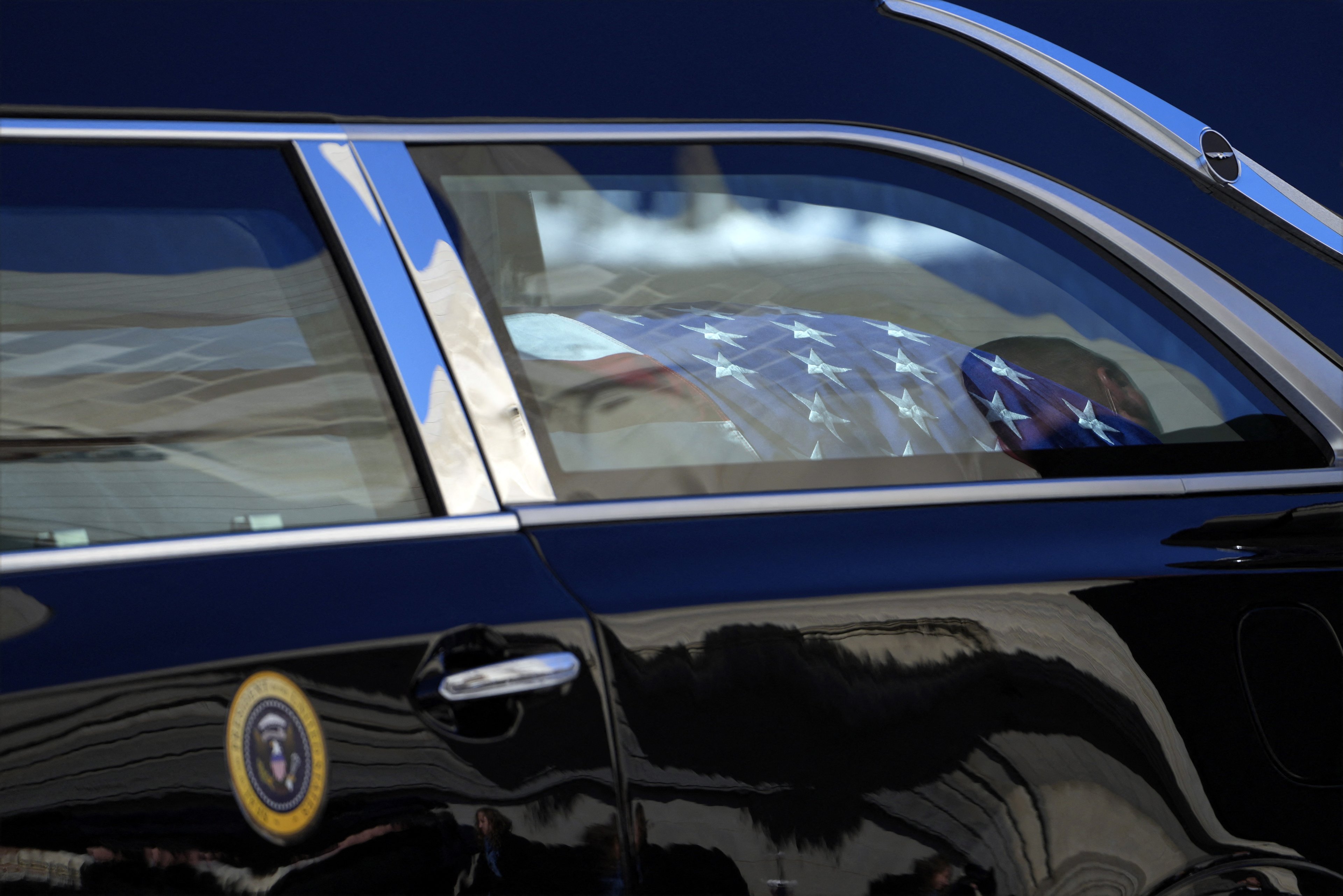 WASHINGTON, DC - JANUARY 09: The flag-draped casket of former President Jimmy Carter is seen in the hearse outside Washington National Cathedral following a state funeral on January 9, 2025 in Washington, DC. President Joe Biden declared today a national day of mourning for Carter, the 39th President of the United States, who died at the age of 100 on December 29, 2024 at his home in Plains, Georgia. Following the state funeral, Carters remains will be returned to Plains, Georgia where he will be interred after a private family service.   Susan Walsh - Pool/Getty Images/AFP (Photo by POOL / GETTY IMAGES NORTH AMERICA / Getty Images via AFP)