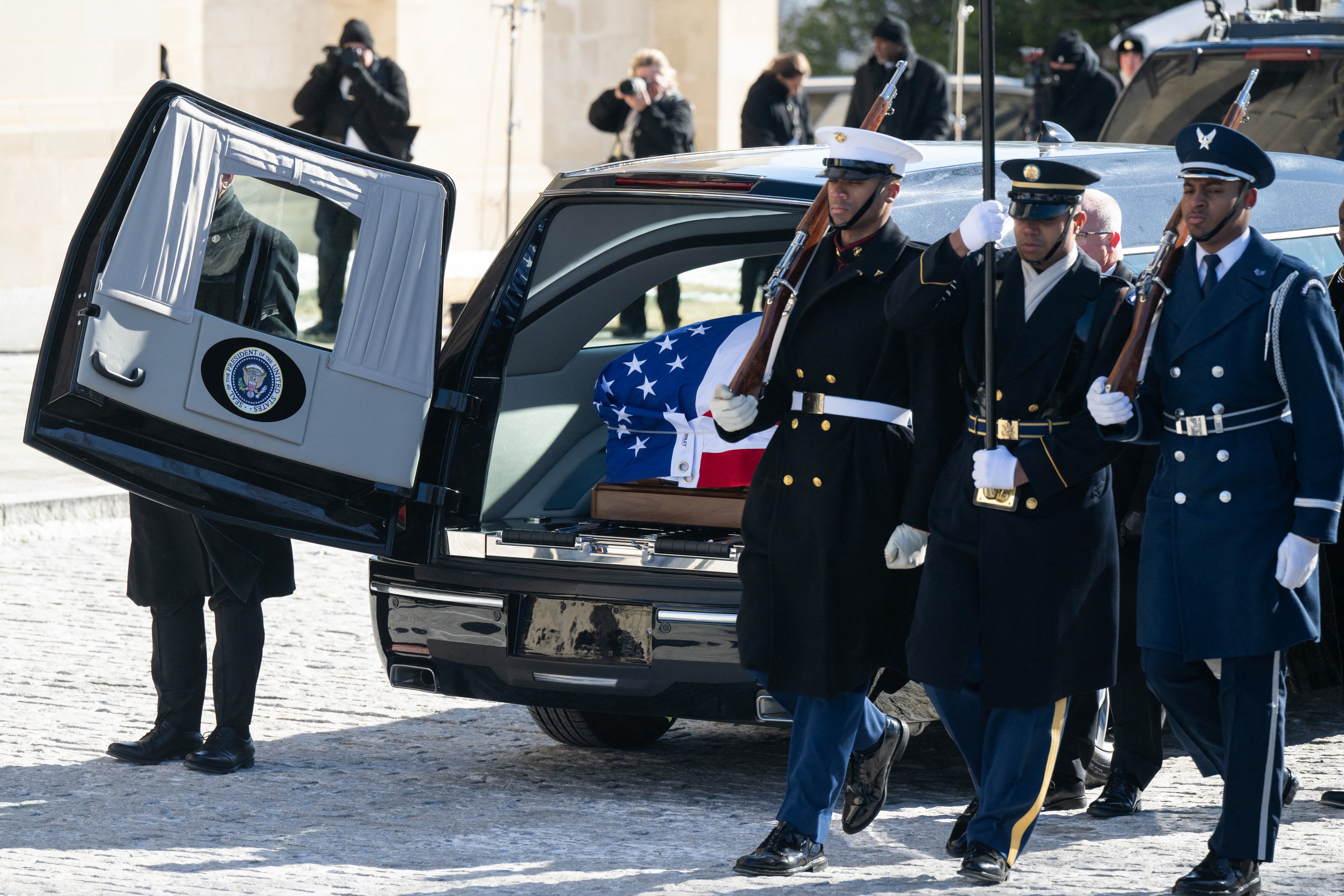 WASHINGTON, DC - JANUARY 09: The casket bearing the remains of former U.S. President Jimmy Carter is placed in a hearse after his state funeral at the National Cathedral on January 9, 2025 in Washington, DC. President Joe Biden declared today a national day of mourning for Carter, the 39th President of the United States, who died at the age of 100 on December 29, 2024 at his home in Plains, Georgia. Following the state funeral, Carters remains will be returned to Plains, Georgia where he will be interred after a private family service.   Saul Loeb-Pool/Getty Images/AFP (Photo by POOL / GETTY IMAGES NORTH AMERICA / Getty Images via AFP)