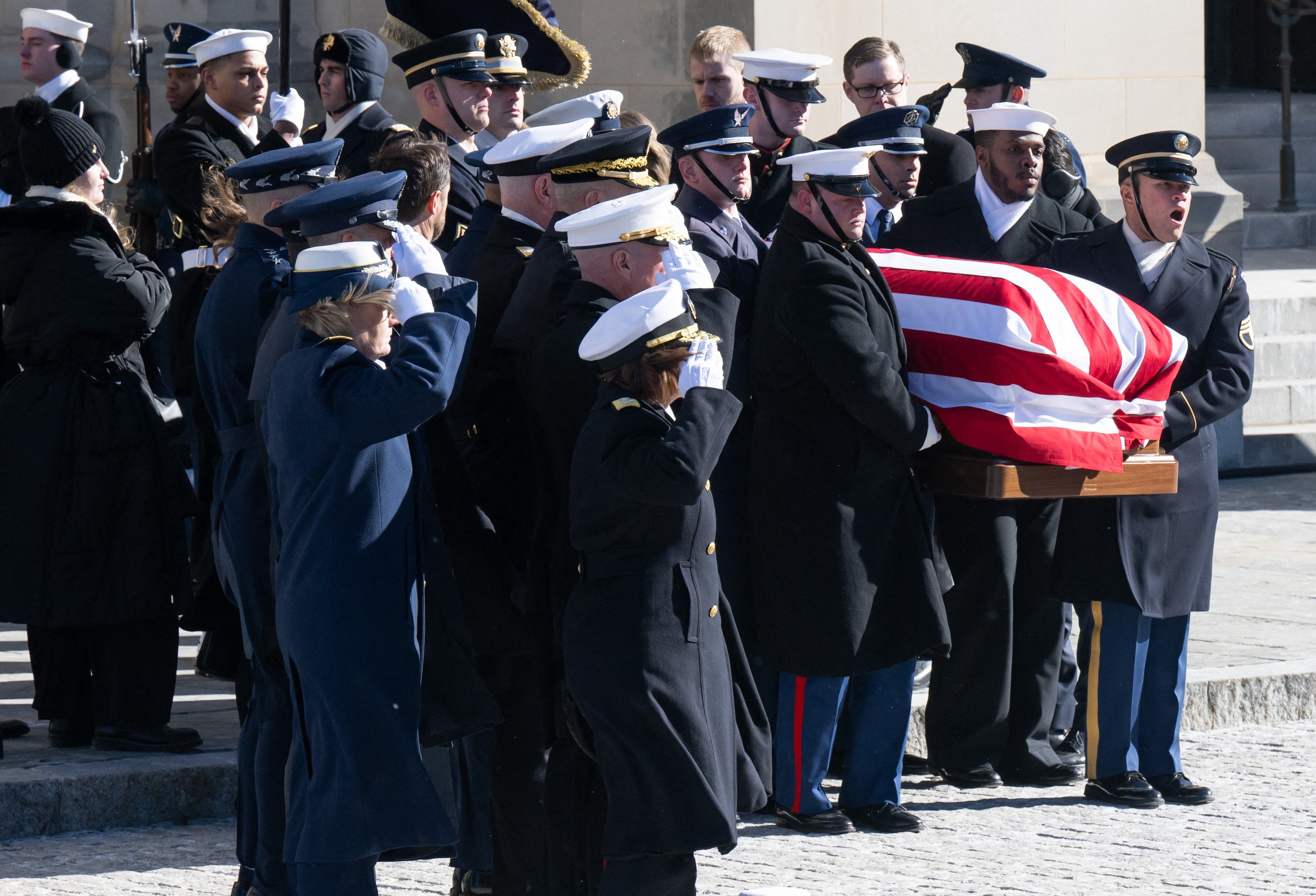 WASHINGTON, DC - JANUARY 09: The casket bearing the remains of former U.S. President Jimmy Carter is carried out of Washington National Cathedral after his state funeral on January 9, 2025 in Washington, DC. President Joe Biden declared today a national day of mourning for Carter, the 39th President of the United States, who died at the age of 100 on December 29, 2024 at his home in Plains, Georgia. Following the state funeral, Carters remains will be returned to Plains, Georgia where he will be interred after a private family service.   Saul Loeb-Pool/Getty Images/AFP (Photo by POOL / GETTY IMAGES NORTH AMERICA / Getty Images via AFP)