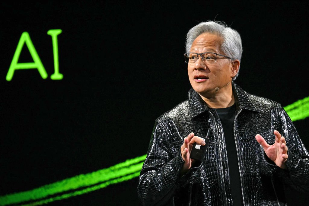 TOPSHOT - Nvidia CEO Jensen Huang delivers a keynote address at the Consumer Electronics Show (CES) in Las Vegas, Nevada on January 6, 2025. Gadgets, robots and vehicles imbued with artificial intelligence will once again vie for attention at the Consumer Electronics Show, as vendors behind the scenes will seek ways to deal with tariffs threatened by US President-elect Donald Trump. The annual Consumer Electronics Show (CES) opens formally in Las Vegas on January 7, 2025, but preceding days are packed with product announcements. (Photo by Patrick T. Fallon / AFP) (Photo by PATRICK T. FALLON/AFP via Getty Images)