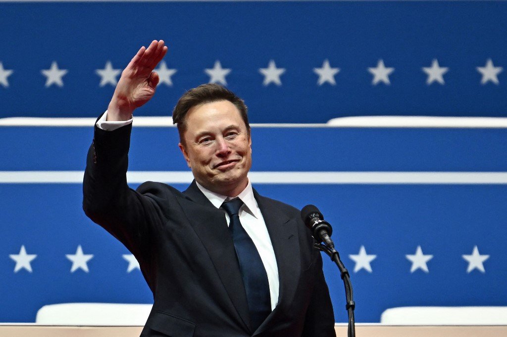 (FILES) Tesla and SpaceX CEO Elon Musk speaks during the inaugural parade inside Capital One Arena, in Washington, DC, on January 20, 2025. US President Donald Trump said in remarks airing on February 9, 2025, that Musk, who is presiding over a purge of US government jobs, will help find "hundreds of billions of dollars of fraud" in federal agencies. Speaking in a Fox News interview set to air before the Super Bowl football championship, Trump said the American people "want me to find" waste and that Musk, the world's richest man and the leader of the president's cost-cutting efforts, has been "a great help" in rooting out unnecessary spending. (Photo by ANGELA WEISS / AFP)