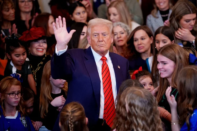 WASHINGTON, DC - FEBRUARY 05: U.S. President Donald Trump waves after signing the "No Men in Women's Sports" executive order in the East Room of the White House on February 5, 2025 in Washington, DC. The executive order, which Trump signed on National Girls and Women in Sports Day, prohibits transgender women from competing in women's sports and is the third order he has signed that targets transgender people.   Andrew Harnik/Getty Images/AFP (Photo by Andrew Harnik / GETTY IMAGES NORTH AMERICA / Getty Images via AFP)