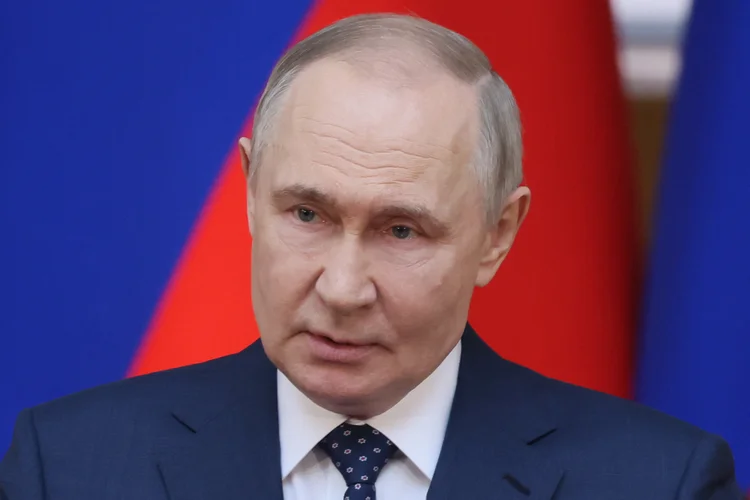 In this pool photograph distributed by the Russian state agency Sputnik, Russia's President Vladimir Putin delivers a speech during a meeting of the Council of Legislators in Saint Petersburg on April 28, 2025. (Photo by Mikhail METZEL / POOL / AFP)