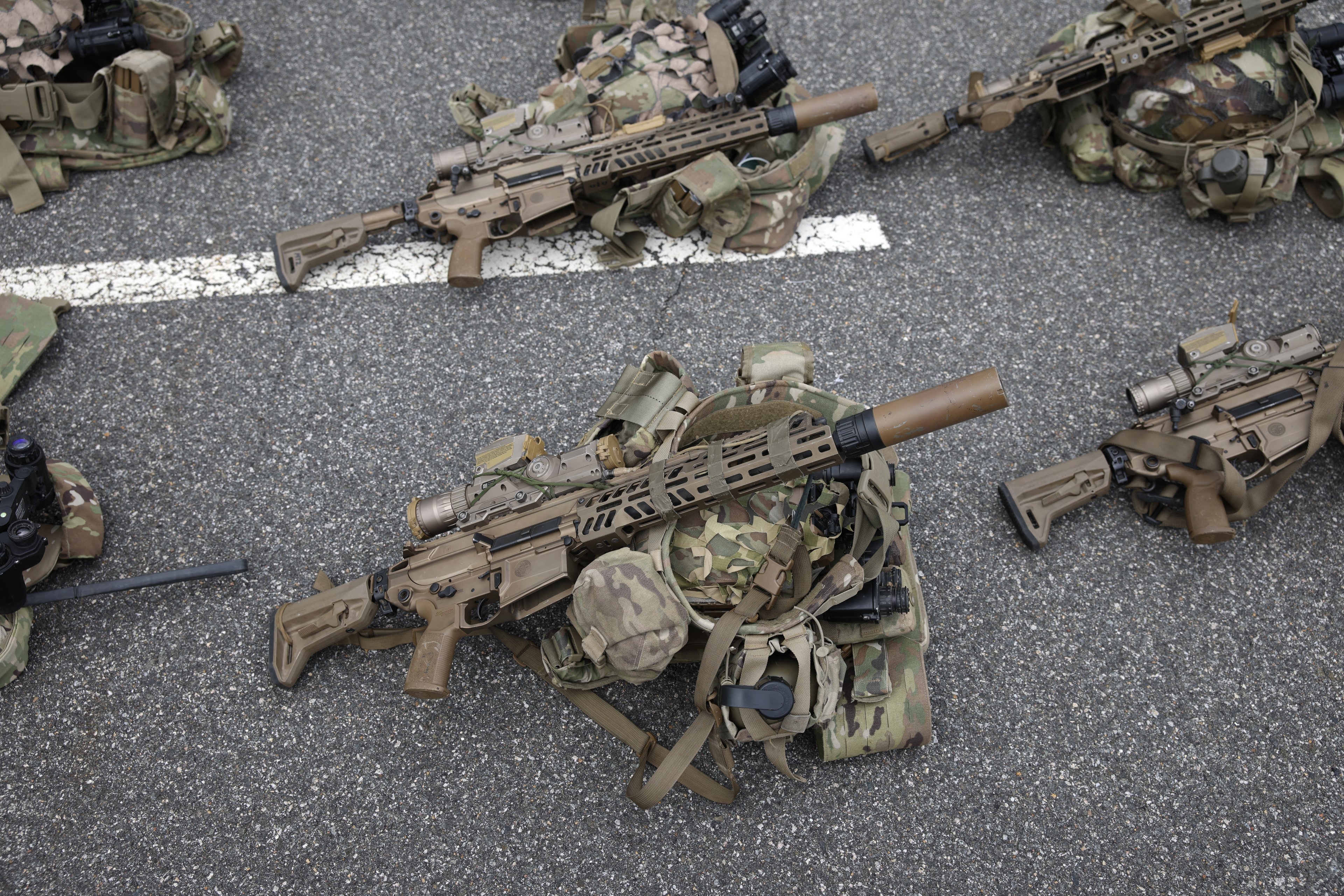 ARLINGTON, VA - JUNE 14: Soldiers' kits with the new XM-7 battle rifle are staged in the Pentagon parking lot on June 14, 2025 in Arlington, Virginia. The U.S. Army is marking its 250th anniversary with a military parade along Constitution Avenue that includes roughly 6,600 troops, 150 vehicles, and over 50 aircraft. The parade, which coincides with President Donald Trump's 79th birthday, is designed to tell the history of the Army.   Samuel Corum/Getty Images/AFP (Photo by Samuel Corum / GETTY IMAGES NORTH AMERICA / Getty Images via AFP)