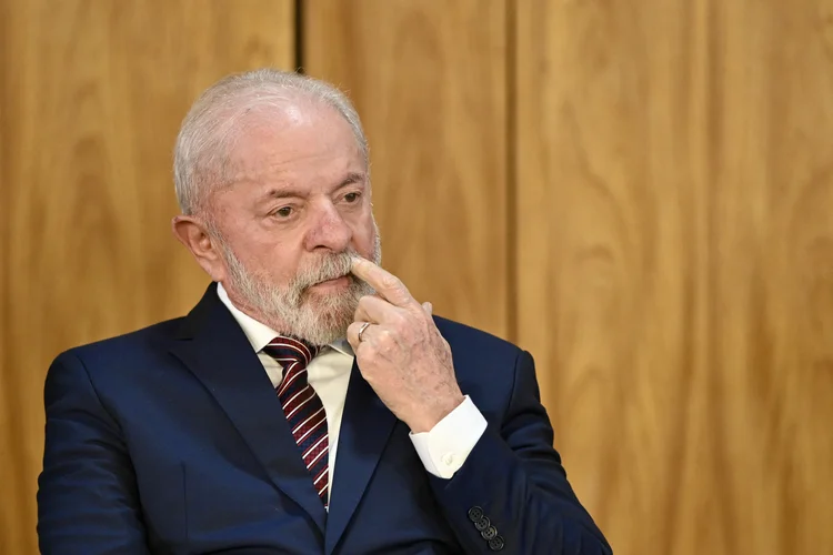 Brazil's President Luiz Inacio Lula da Silva gestures during the signing of the new export incentive law at the Planalto Palace in Brasilia on July 28, 2025. (Photo by EVARISTO SA / AFP)