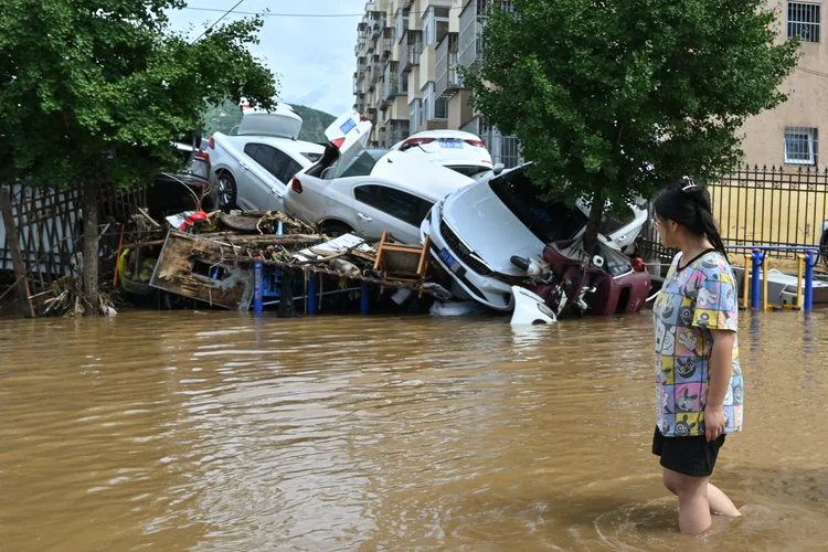 Inundações em Pequim: chuvas fortes causaram deslizamentos e mataram 30 pessoas no distrito de Miyun, no norte da cidade. (ADEK BERRY/AFP )