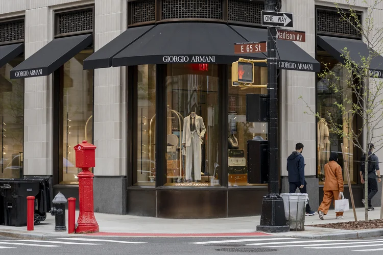 NEW YORK, NEW YORK - MAY 25: People walk by the Giorgio Armani store on Madison Avenue during Memorial Day weekend on May 25, 2025 in New York City. (Photo by Craig T Fruchtman/Getty Images) (Craig T Fruchtman/Getty Images)