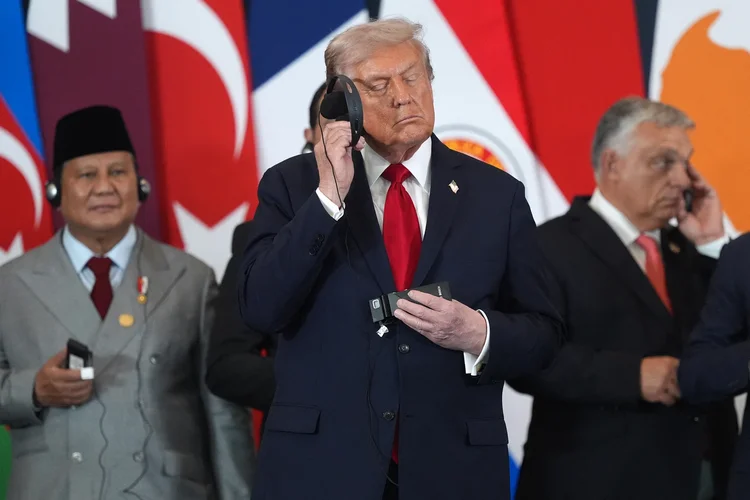 US President Donald Trump listens as Egypt's President Abdel Fattah al-Sisi (not pictured) delivers a statement during a summit on Gaza in Sharm el-Sheikh on October 13, 2025. Trump landed in Egypt on October 13 for a summit on Gaza, following a lightning visit to Israel after a ceasefire he brokered entered into force. (Photo by Evan Vucci / POOL / AFP)