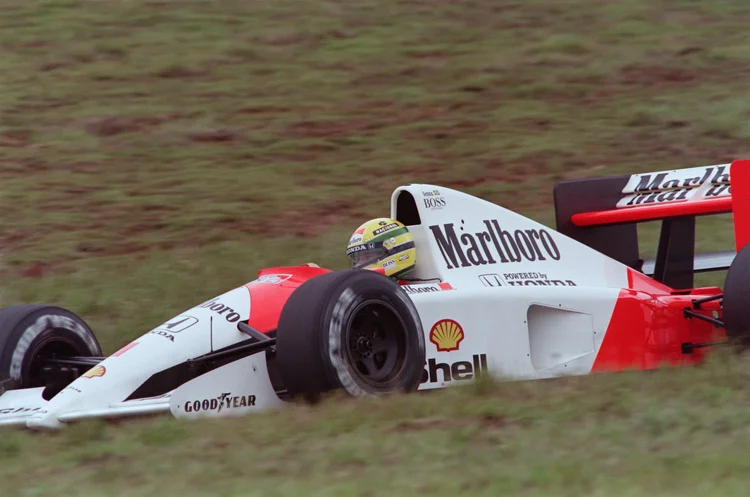 Brazilian F1 driver and current world champion Ayrton Senna clinches on March 23, 1991 the pole position for March 24 Brazilian Grand Prix at the wheel of his mCLaren Honda in Sao Paulo. (Photo by Jerome DELAY / AFP)        (Photo credit should read JEROME DELAY/AFP via Getty Images) (JEROME DELAY/AFP/Getty Images)