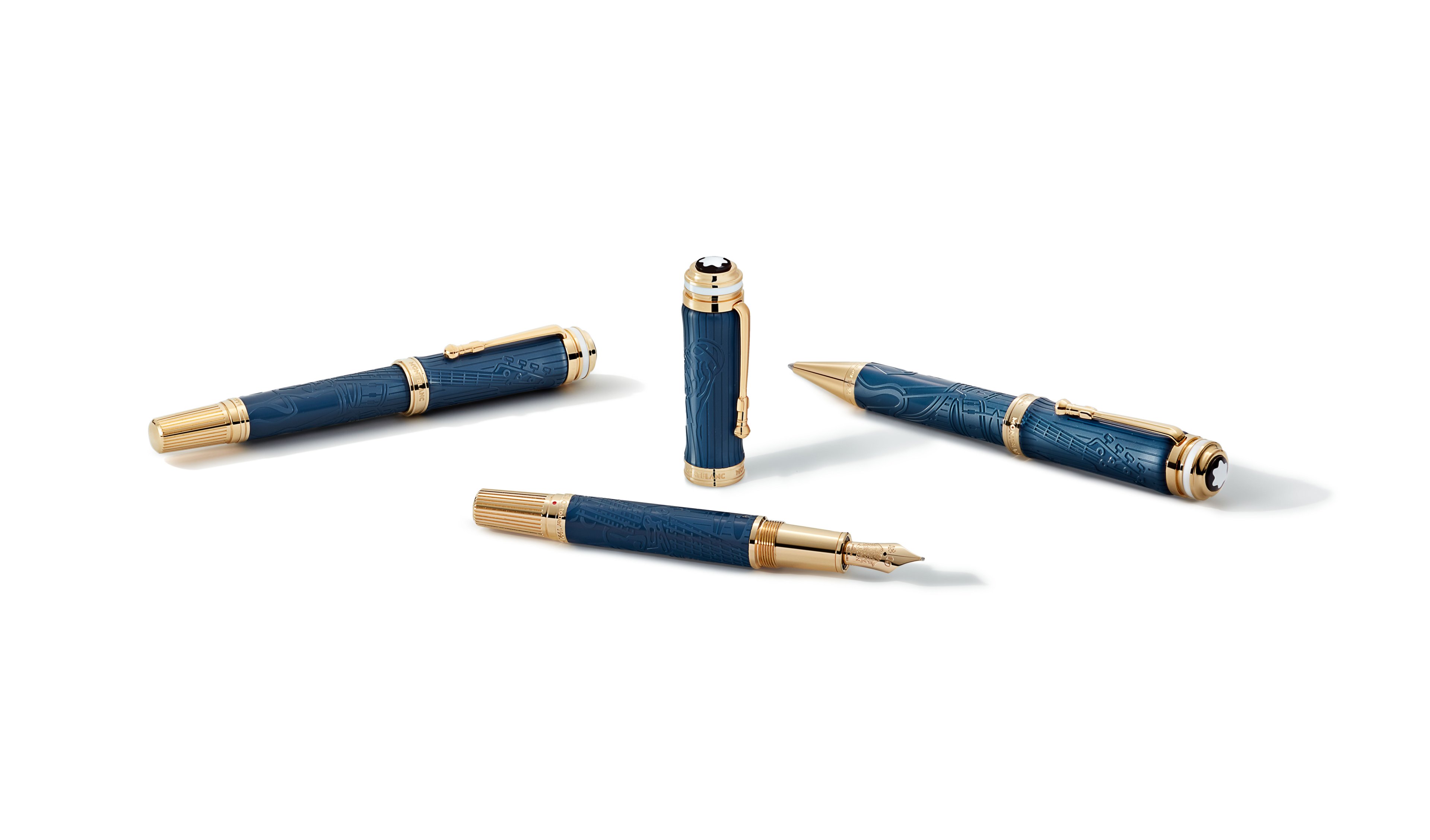 Caneta Montblanc Queen Special Edition em resina azul-escura com detalhes dourados e símbolos dos integrantes.