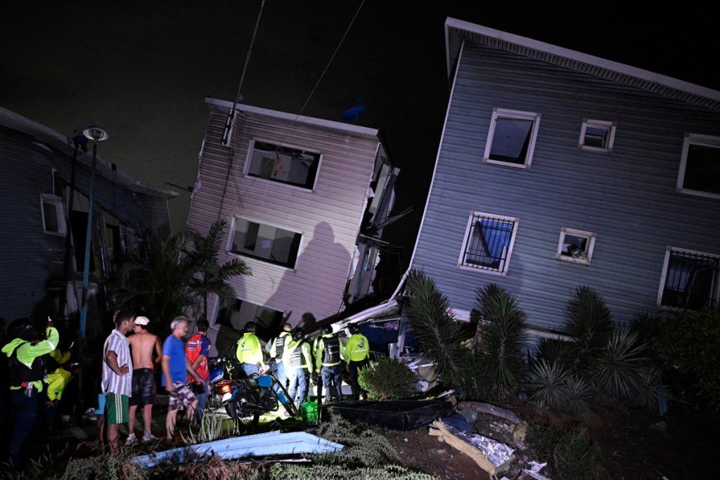 Residents and exigency  workers basal   adjacent   damaged buildings pursuing  an earthquake successful  Catia La Mar, immoderate   30kms north-west of Caracas, aboriginal  connected  June 25, 2026. Powerful duplicate  earthquakes person  killed 32 radical   and injured much  than 700, the nation's interim president   said connected  June 25, aft  the monolithic  shocks collapsed full  buildings and sent radical   moving  successful  panic.